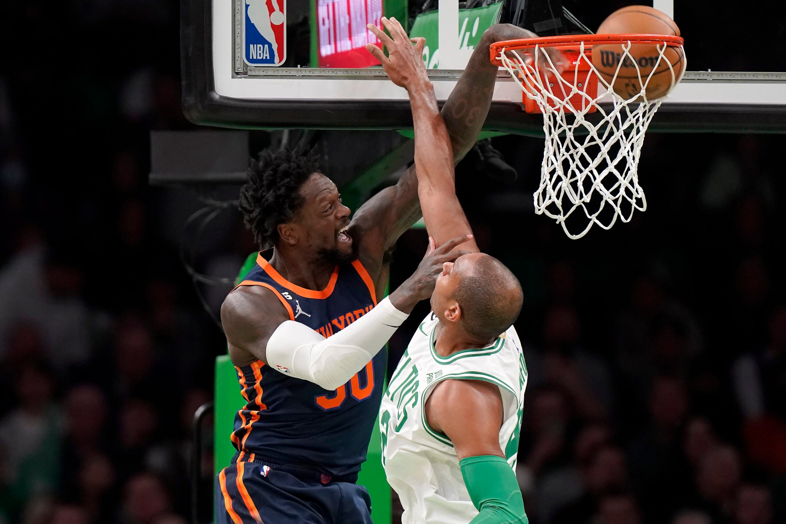 Knicks forward Julius Randle drives to the basket to score as Al Horford defends during the first half.
