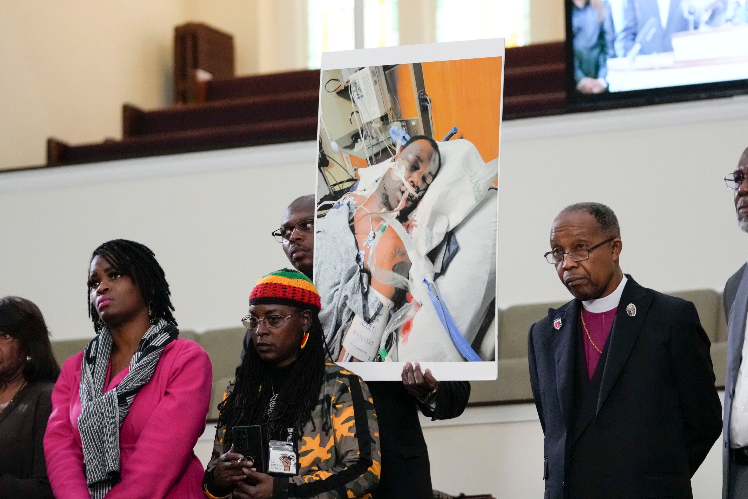 FILE - Family members and supporters hold a photograph of Tyre Nichols at a news conference in Memphis, Tenn., Jan. 23, 2023. The U.S. Attorney’s Office said Wednesday, Jan. 25, 2023 the federal investigation into the death of a Black man who died after a violent arrest by Memphis police “may take some time.” Speaking during a news conference, U.S. Attorney Kevin G. Ritz said his office is working with the Justice Department's Civil Rights Division in Washington as it investigates the case of Tyre Nichols, who died three days after his Jan. 7 arrest. (AP Photo/Gerald Herbert, file)