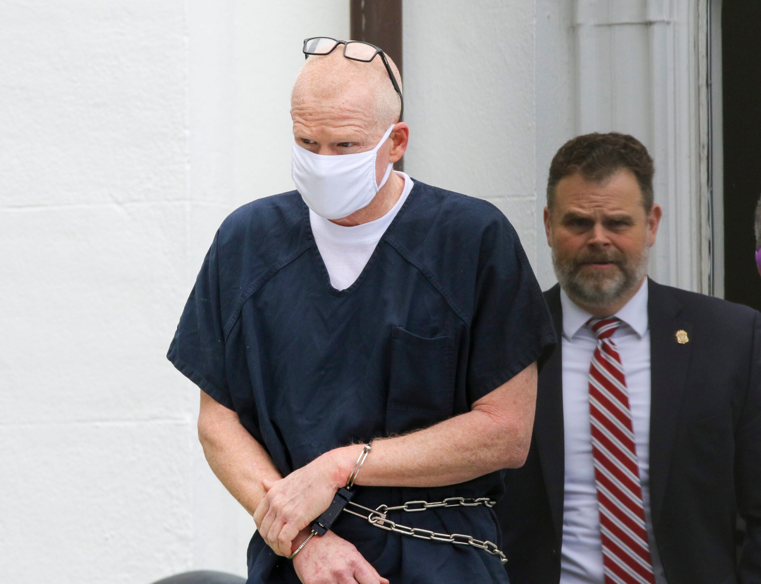 alt= Alex Murdaugh is escorted out of the Colleton County Courthouse in Walterboro, S.C., on July 20, 2022. Murdaugh's trial on two counts of murder in the June 2021 deaths of his wife and son is scheduled to start Monday, Jan. 23, 2023.