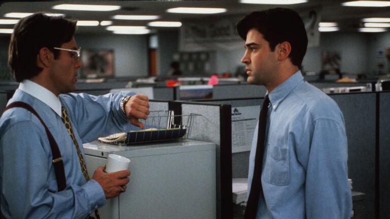 A disgruntled computer programmer named Peter, played by Ron Livingston (right) endures another lecture by his boss, played by Gary Cole, in this scene from the 1999 movie "Office Space."