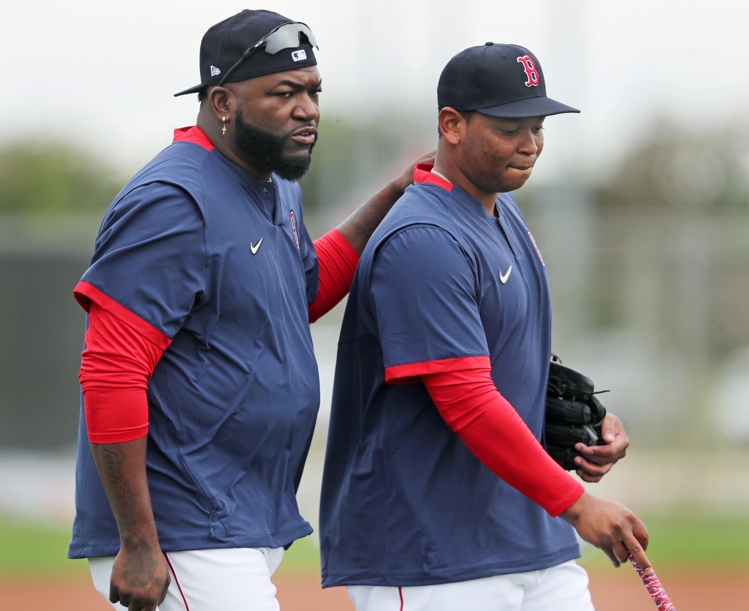 Rafael Devers (right) made his first appearence in camp today, he is pictured with David Ortiz (left) before he started to participate in a workout. The Red Sox continued Spring Training workouts today at the Jet Blue Park complex.
