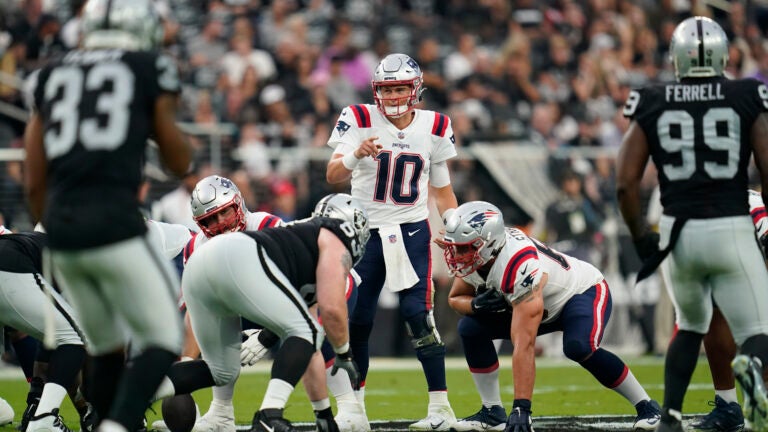 New England Patriots quarterback Mac Jones (10) calls a play during an NFL football game against the Las Vegas Raiders Monday, Aug. 29, 2022, in Las Vegas, Nevada.