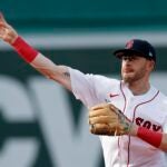 Boston Red Sox's Trevor Story throws to first base on the force out single by Texas Rangers' Marcus Semien during the third inning of a baseball game, Saturday, Sept. 3, 2022, in Boston.