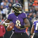 Baltimore Ravens quarterback Lamar Jackson (8) looks to pass the ball during the first half of an NFL football game against the Denver Broncos, Sunday, Dec. 4, 2022, in Baltimore.
