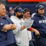 New England Patriots senior football advisor Matt Patricia, center, looks on with offensive assistant Joe Judge, right, and head coach Bill Belichick during an NFL football game against the Baltimore Ravens at Gillette Stadium, Sunday, Sunday, Sept. 24, 2022 in Foxborough, Mass.