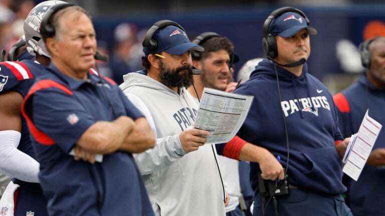New England Patriots senior football advisor Matt Patricia, center, looks on with offensive assistant Joe Judge, right, and head coach Bill Belichick during an NFL football game against the Baltimore Ravens at Gillette Stadium, Sunday, Sunday, Sept. 24, 2022 in Foxborough, Mass.