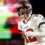 Tom Brady #12 of the Tampa Bay Buccaneers yells as he runs on the field prior to the NFC Wild Card playoff game against the Dallas Cowboys at Raymond James Stadium on January 16, 2023 in Tampa, Florida.