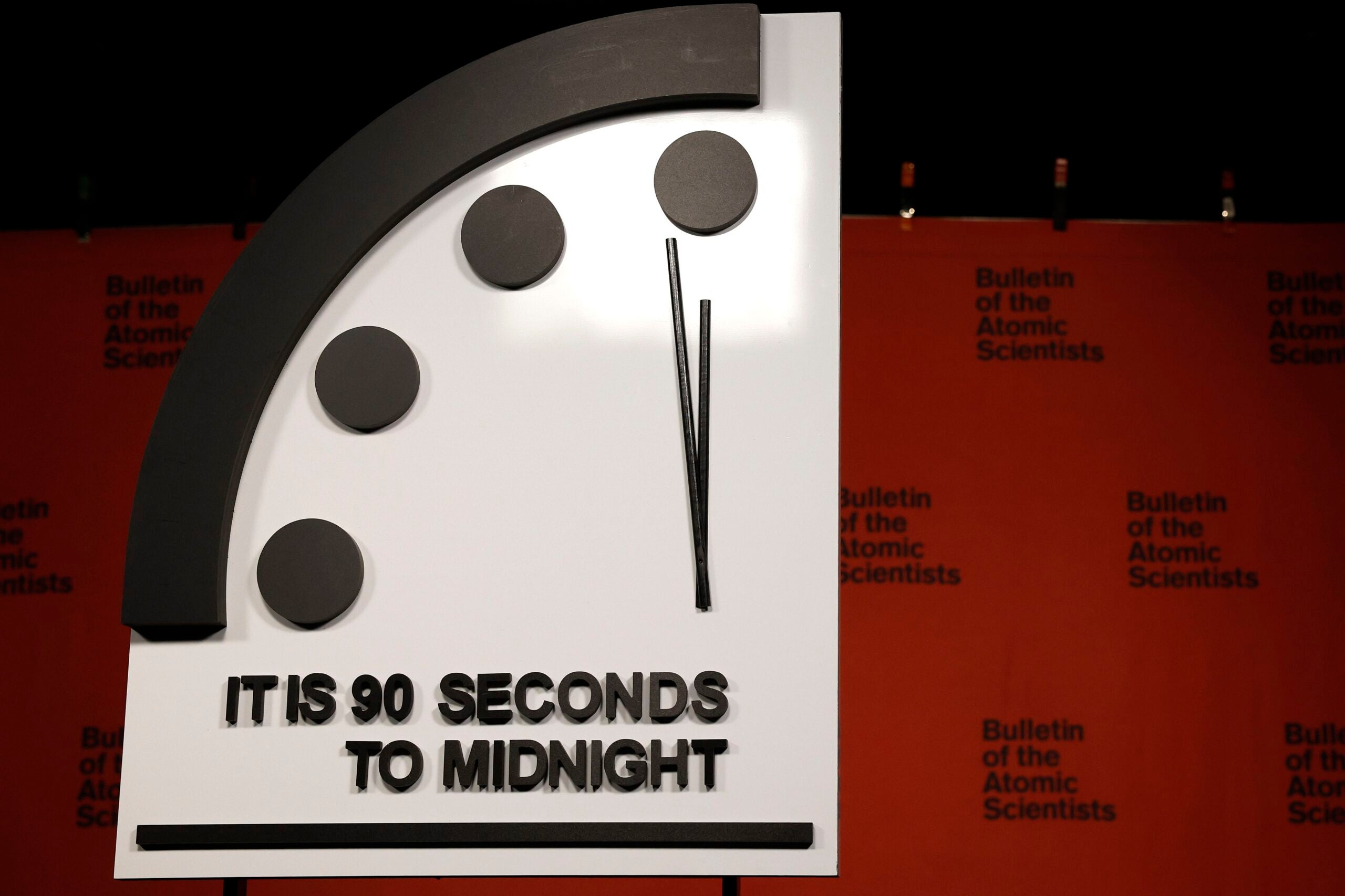 alt = the 2023 Doomsday Clock is set at 90 seconds to midnight.