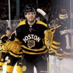 Jake DeBrusk #74 of the Boston Bruins celebrates with teammates after scoring a goal against the Pittsburgh Penguins during the third period in the 2023 Discover NHL Winter Classic at Fenway Park on January 02, 2023 in Boston, Massachusetts.