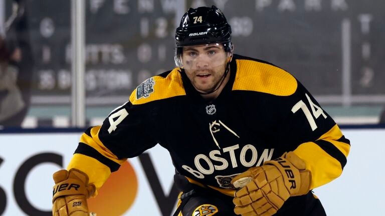 Boston Bruins' Jake DeBrusk plays against the Pittsburgh Penguins during the third period of the NHL Winter Classic hockey game, Monday, Jan. 2, 2023, at Fenway Park in Boston.