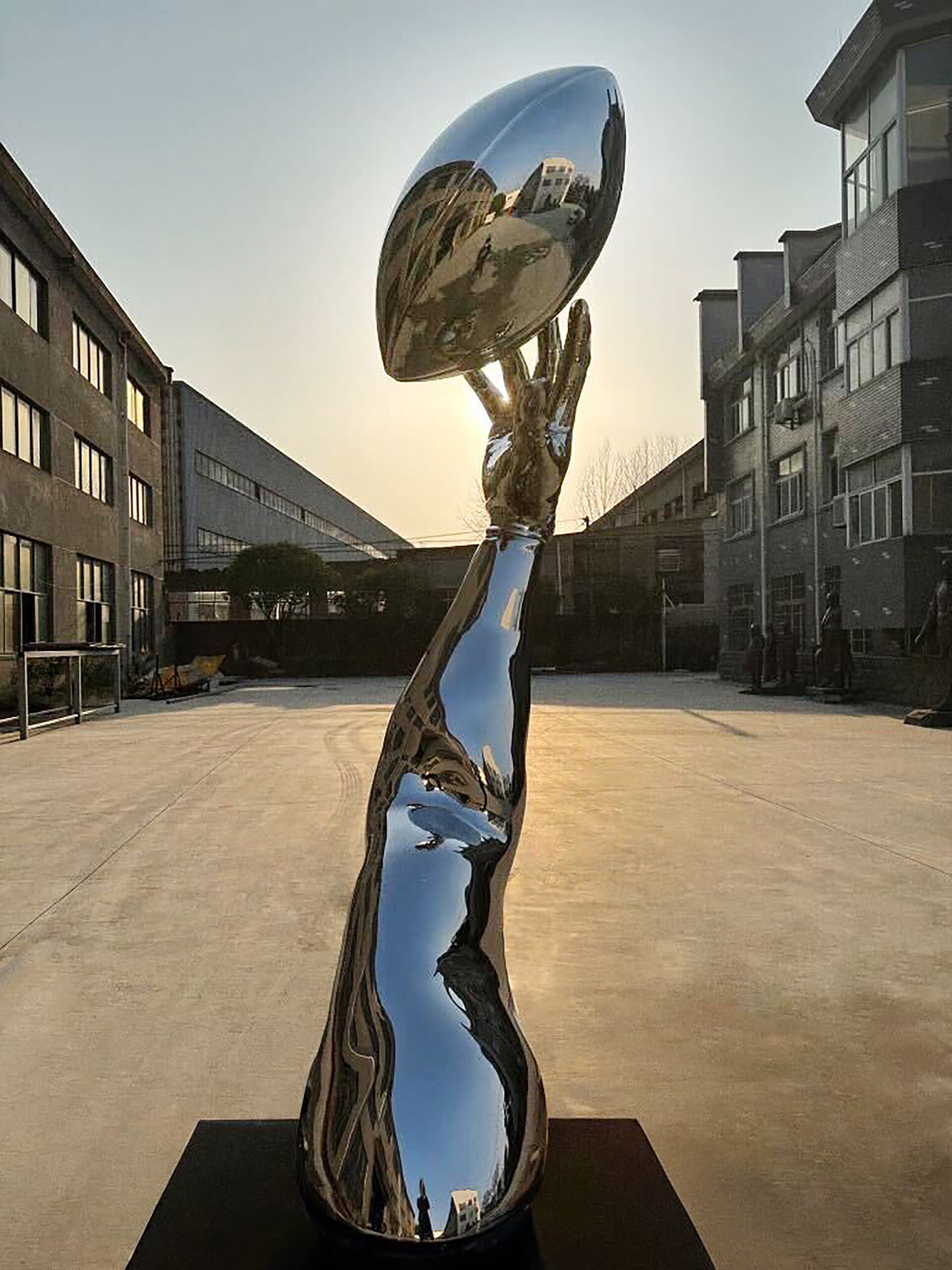 “Opportunity (reflection)” by Hank Willis Thomas. Its reflective surface resembles the Vince Lombardi Trophy given to the winning Super Bowl team.
