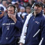 atriots quarterback Tom Brady (12) walks towards the bench as head coach Bill Belichick (center) and offensive coordinator Bill O'Brien (right) watch. he New England Patriots visited the Washington Redskins in an NFL regular season game at FedEx Field.