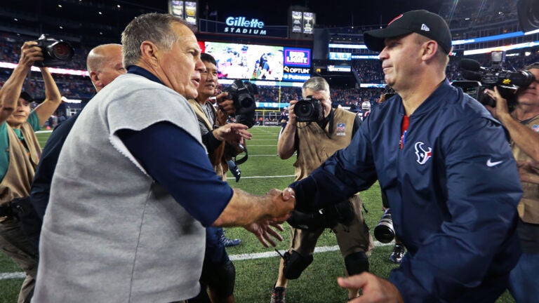 Patriots head coach Bill Belichick (left) and Texans head coach Bill O'Brien (right) shake hands after New England's victory. The New England Patriots hosted the Houston Texans in a Thursday night NFL regular season football game.