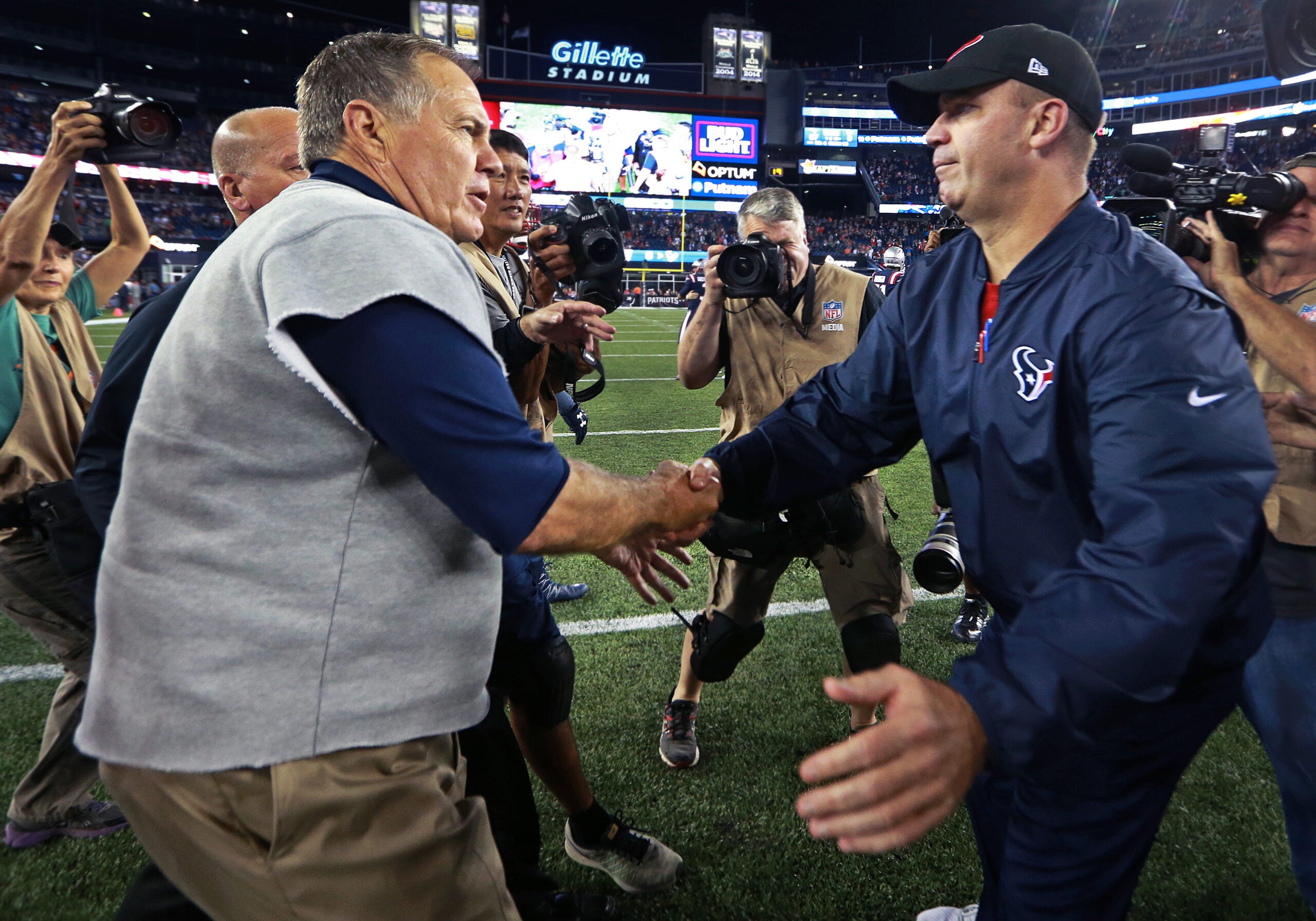 Patriots head coach Bill Belichick (left) and Texans head coach Bill O'Brien (right) shake hands after New England's victory. The New England Patriots hosted the Houston Texans in a Thursday night NFL regular season football game.
