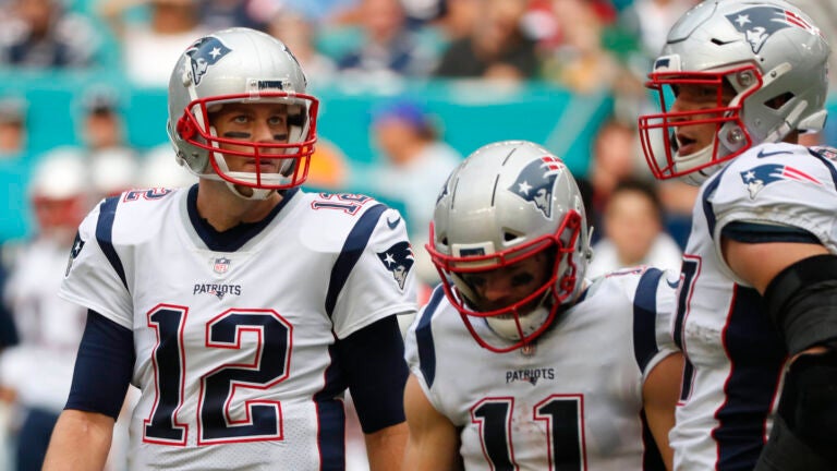 New England Patriots quarterback Tom Brady, left, and wide