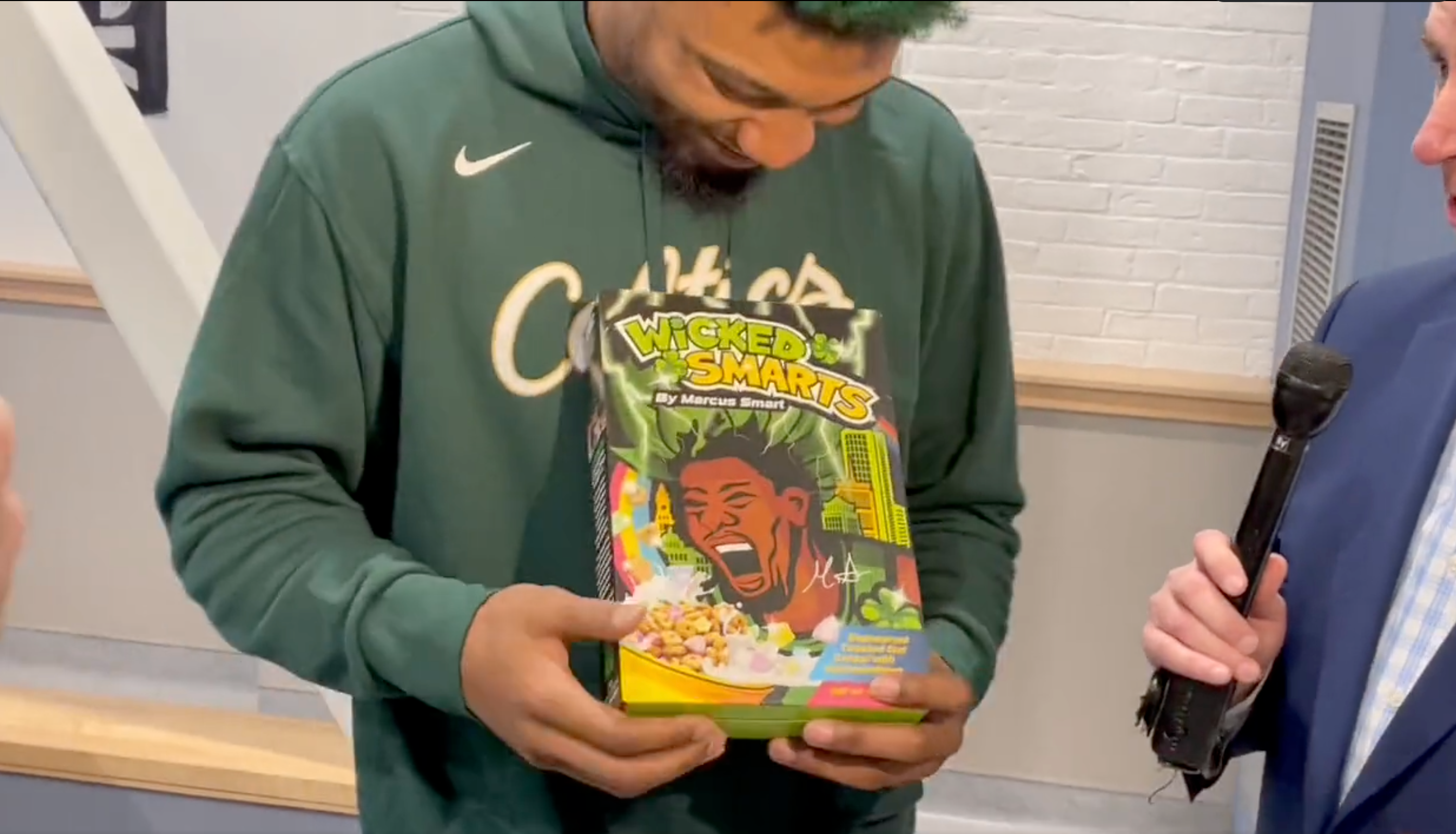 Marcus Smart holding his cereal box