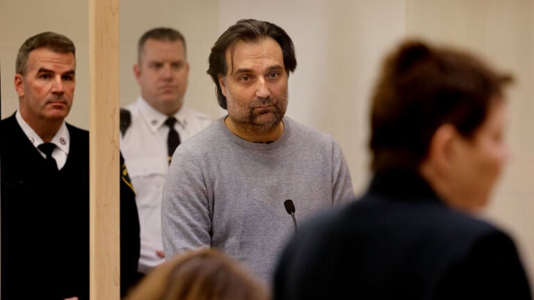 Brian Walshe listens to prosecutor Lynn Beland during his arraignment at Quincy District Court on a charge of murdering his wife Ana Walshe.