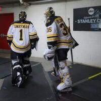Boston Bruins goalies Jeremy Swayman (1) and Linus Ullmark (35) heading to their locker room after their pre-skate before playing the Carolina Hurricanes during game 5 of the NHL Playoffs at PNC Arena.