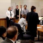 Brian Walshe listens to prosecutor Lynn Beland during his arraignment at Quincy District Court on Wednesday.