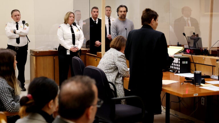 Brian Walshe listens to prosecutor Lynn Beland during his arraignment at Quincy District Court on Wednesday.