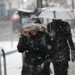 Pedestrians brace against the snow on Commonwealth Avenue on Monday.