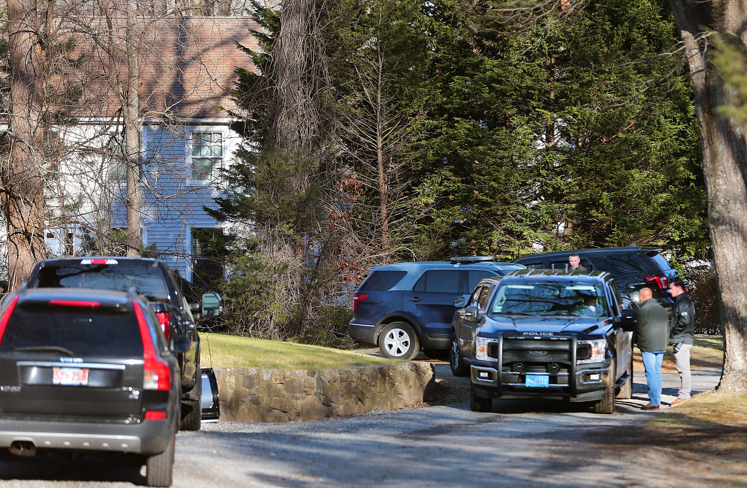 Investigators at the Walshes' Cohasset home on Jan. 10.