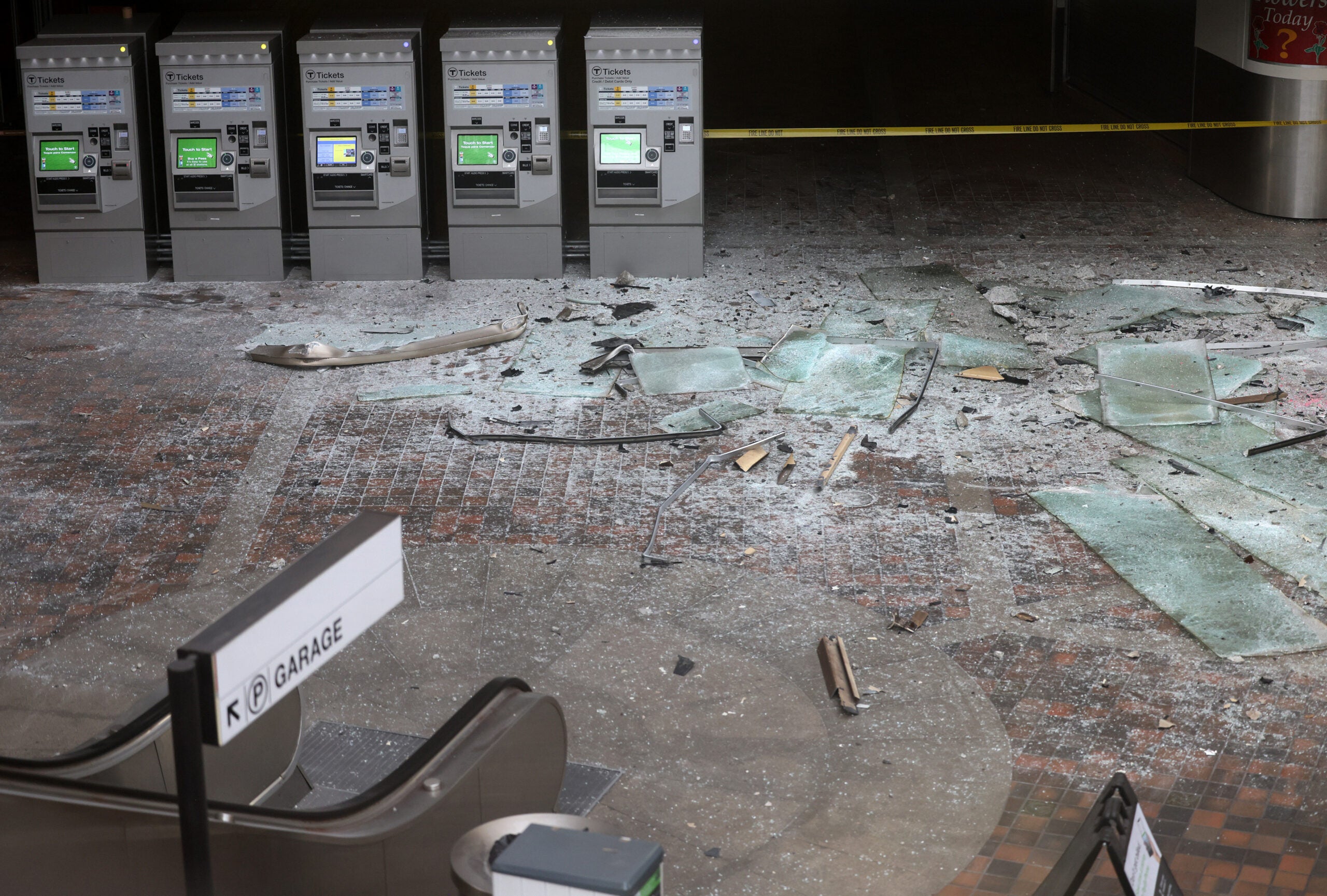 The empty Alewife lobby is shown with broken glass blanketing the ground following the crash.