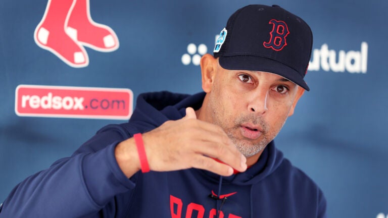 Red Sox manager Alex Cora is pictured as he answers questions from reporters.