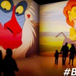 Floor-to-ceiling images from "The Lion King" are projected on the walls at "Disney Animation: Immersive Experience."
