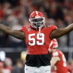 Broderick Jones #59 of the Georgia Bulldogs celebrates after a touchdown in the second quarter against the TCU Horned Frogs in the College Football Playoff National Championship game at SoFi Stadium on January 09, 2023 in Inglewood, California.
