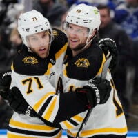 Boston Bruins' Pavel Zacha, right, celebrates scoring a goal against the Toronto Maple Leafs with teammate Taylor Hall during the third period.