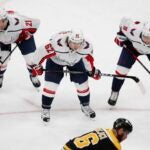 Washington Capitals' Garnet Hathaway (21), Carl Hagelin (62) and Dmitry Orlov (9) play against the Boston Bruins during the first period of an NHL hockey game, Sunday, April 18, 2021, in Boston.