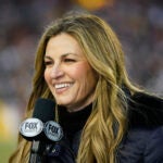 Fox Sports reporter Erin Andrews on the field during the first half an NFL football game between the Dallas Cowboys and Washington Commanders, Sunday, Jan. 8, 2023, in Landover, Md.