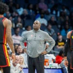 Former Hawks coach Nate McMillan looking on from the sidelines.
