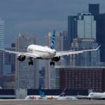 A JetBlue plane lands at Logan Airport, Thursday, Jan. 26, 2023.