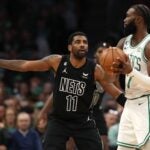 Kyrie Irving #11 of the Brooklyn Nets defends Jaylen Brown #7 of the Boston Celtics during the first half at TD Garden on February 01, 2023 in Boston, Massachusetts.