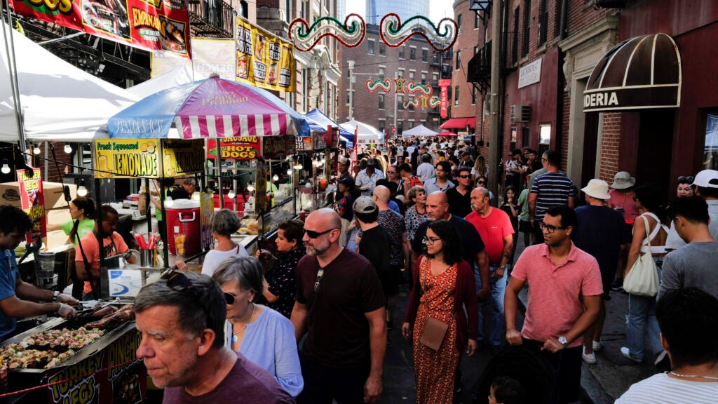 People pass through the packed streets at St. Anthony's Feast in the North End of Boston on August 28, 2022.
