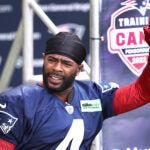 Patriots Malcolm Butler waves to fans as he arrives on the field as the New England Patriots held their 3rd day of training camp on the practice fields behind Gillette Stadium on Thursday morning.