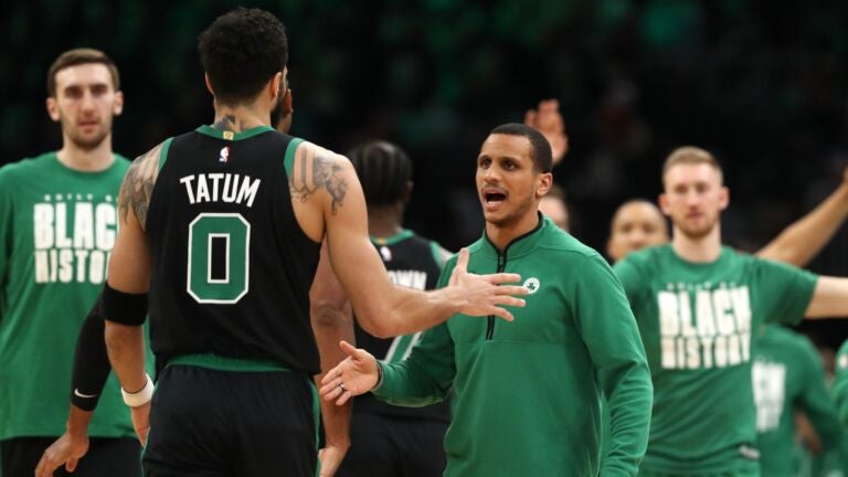 Boston Celtics head coach Joe Mazzulla celebrates with Jayson Tatum #0 during the game against the Phoenix Suns at TD Garden on February 03, 2023 in Boston, Massachusetts.