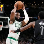 Jaylen Brown facing up against Kyrie Irving.