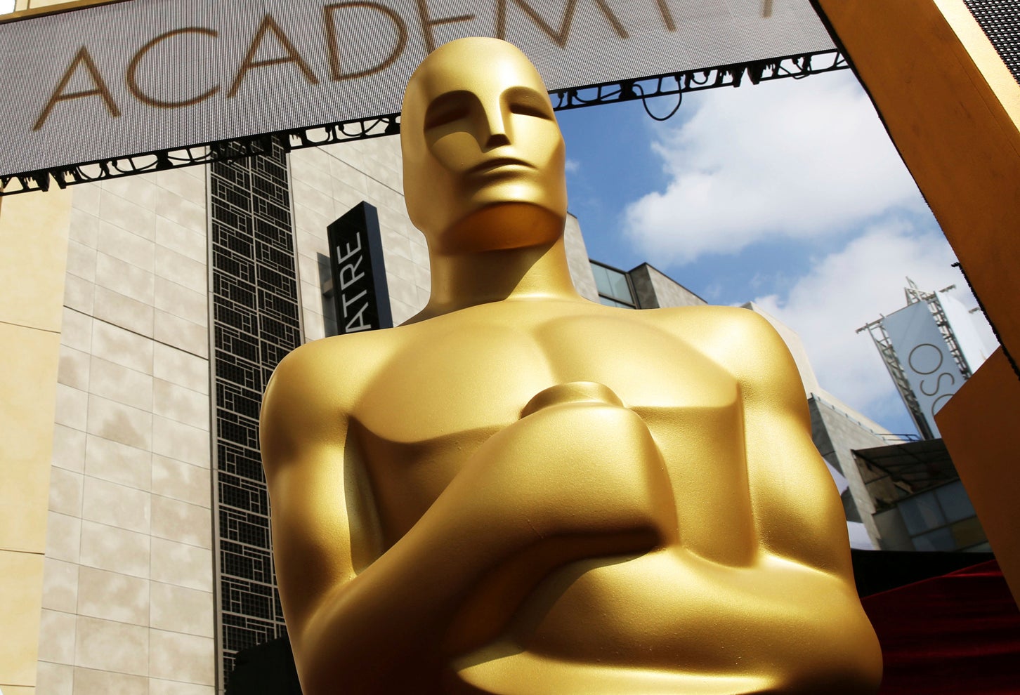 alt = a large gold Oscar statue appears outside the Dolby Theatre for the 87th Academy Awards in Los Angeles.