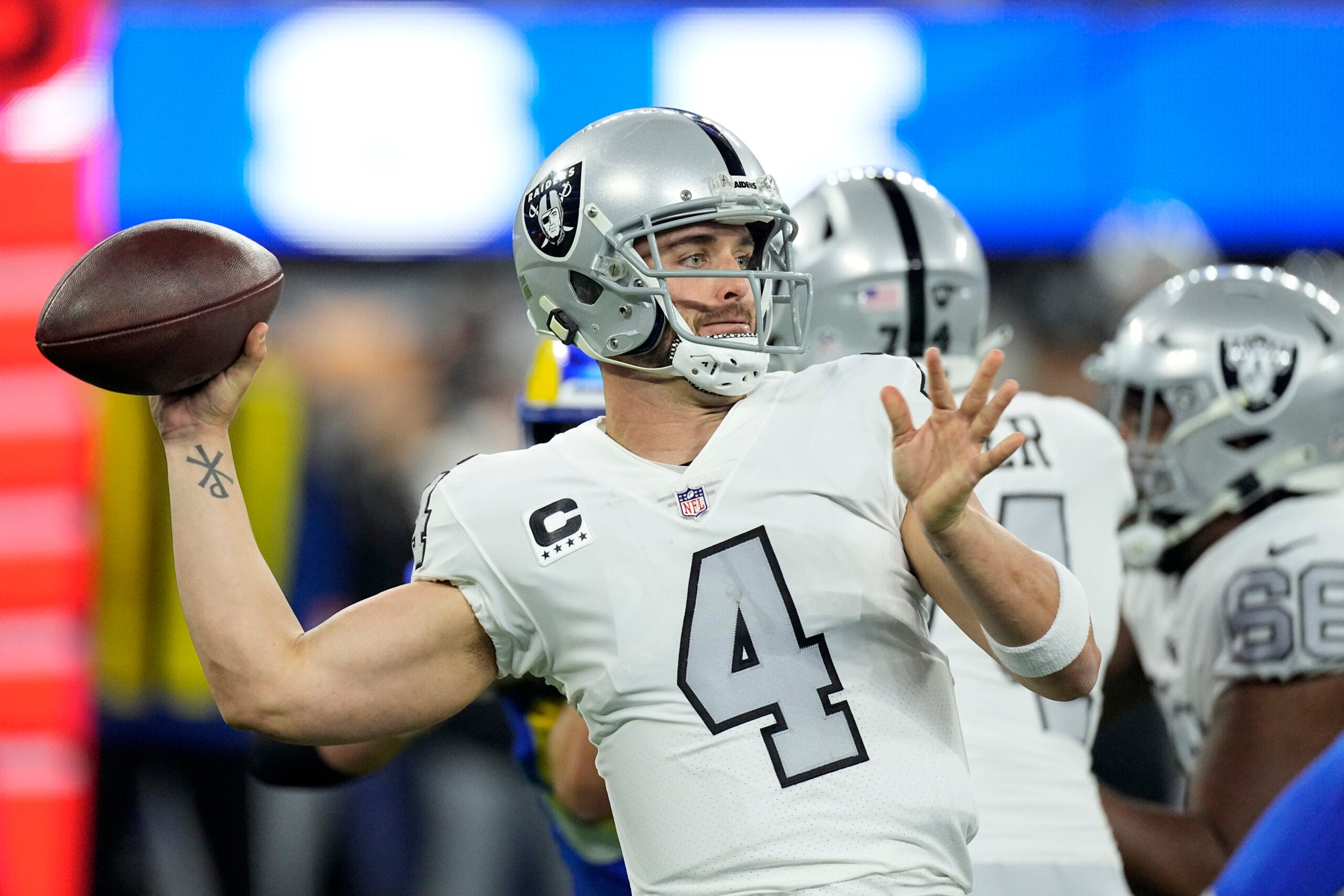 Free agent quarterback Derek Carr throwing a pass for the Raiders.