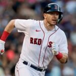 Boston Red Sox's Trevor Story runs on his RBI double during the seventh inning of a baseball game against the Texas Rangers, Saturday, Sept. 3, 2022, in Boston.