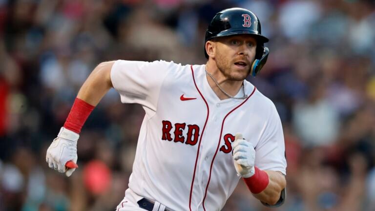 Trevor Story of the Boston Red Sox reacts after hitting an RBI