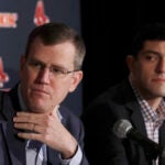 FILE - In this Jan. 15, 2020, file photo, Boston Red Sox team CEO Sam Kennedy, left, and Chief Baseball Officer Chaim Bloom participate during a news conference at Fenway Park in Boston. The Boston Red Sox were stripped of their second-round pick in this year’s amateur draft by Major League Baseball for breaking video rules in 2018 and former manager Alex Cora was suspended through the 2020 postseason for his conduct as bench coach with the Houston Astros the previous year. Baseball Commissioner Rob Manfred announced his decision Wednesday, April 22, 2020, concluding Red Sox replay system operator J.T. Watkins used in-game video to revise sign sequences provided to players.
