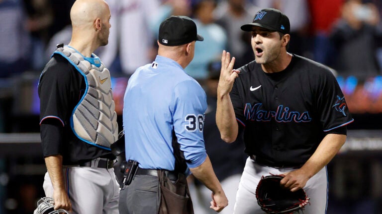 Catcher Jacob Stallings looks on as Richard Bleier of Miami angrily reacts after being called for three balks during the eighth inning on Sept. 27, 2022, against the Mets.
