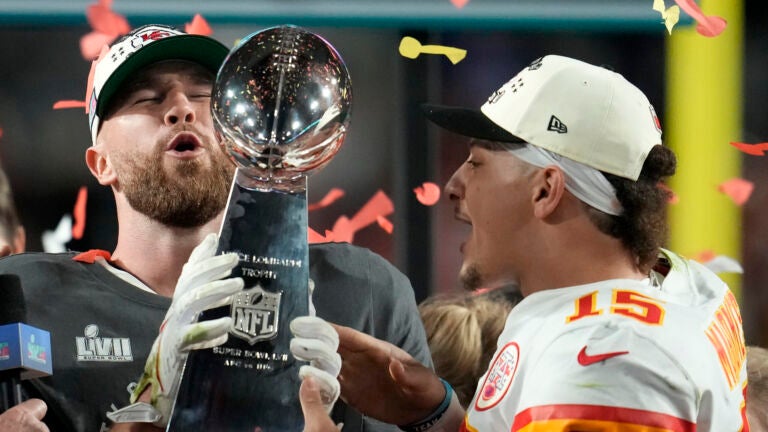 Kansas City Chiefs tight end Travis Kelce, left, and quarterback Patrick Mahomes (15) holds the Vince Lombardi Trophy after the NFL Super Bowl 57 football game against the Philadelphia Eagles, Sunday, Feb. 12, 2023, in Glendale, Ariz. The Kansas City Chiefs defeated the Philadelphia Eagles 38-35.