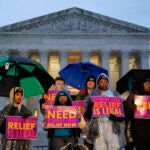Student debt relief advocates gather outside the Supreme Court on Capitol Hill in Washington, Monday, Feb. 27.