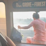 A person is shown exiting a smoking MBTA Orange Line car by jumping out a window.