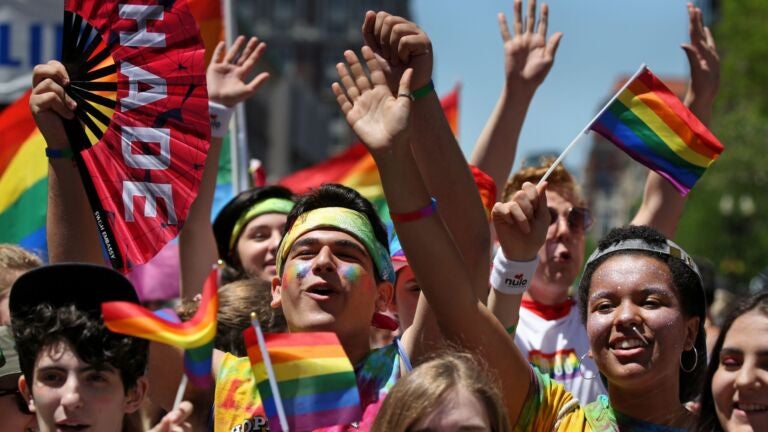 Members of Hopedale Gender Sexuality Alliance (GSA) cheer at the start of the Boston Pride Parade in Boston, MA on June 08, 2019.